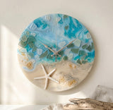 Handmade ocean wall clock close-up showing gold flake accents and embedded sea glass detail
